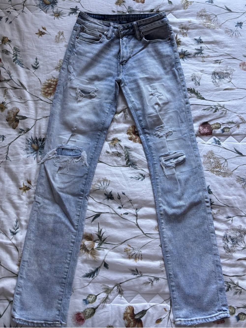 American Eagle Outfitters AirFlex + 
Slim Fit Light Blue Distressed Denim Jeans